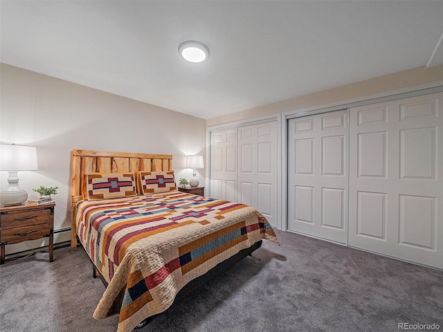 bedroom with carpet flooring and two closets