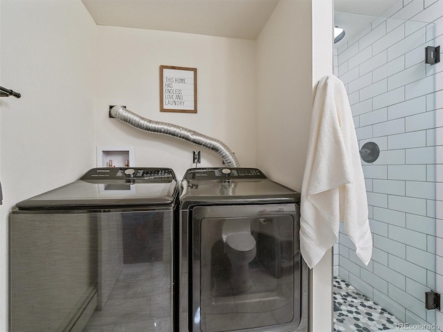 washroom with laundry area and washing machine and clothes dryer