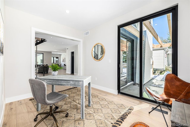 home office with light wood-style floors, baseboards, visible vents, and recessed lighting