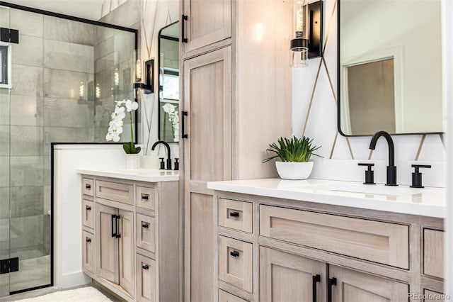 bathroom featuring a shower stall and vanity