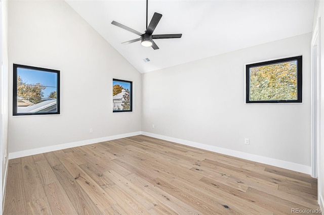 empty room featuring baseboards, light wood finished floors, and a healthy amount of sunlight