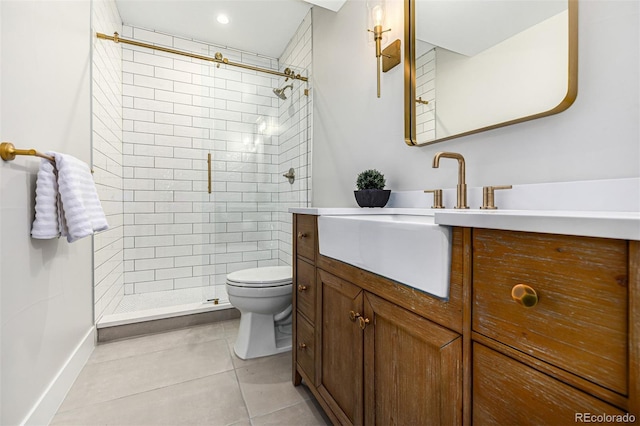 full bath with baseboards, toilet, tile patterned floors, a tile shower, and vanity