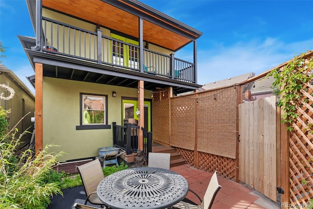 3313 Curtis St, Denver, CO 80205 - view of patio / terrace featuring a balcony and outdoor dining space