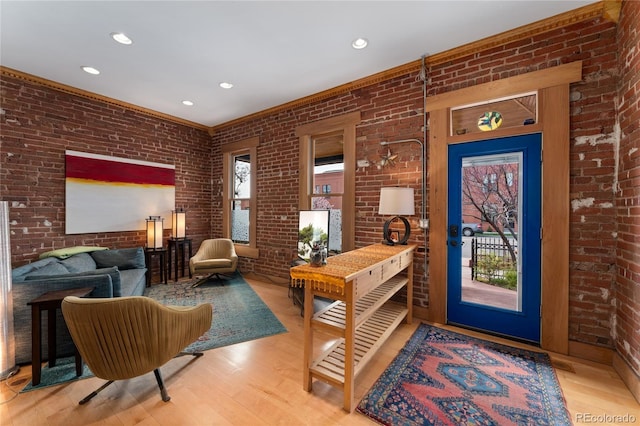 3313 Curtis St, Denver, CO 80205 - foyer entrance with brick wall, wood finished floors, and recessed lighting