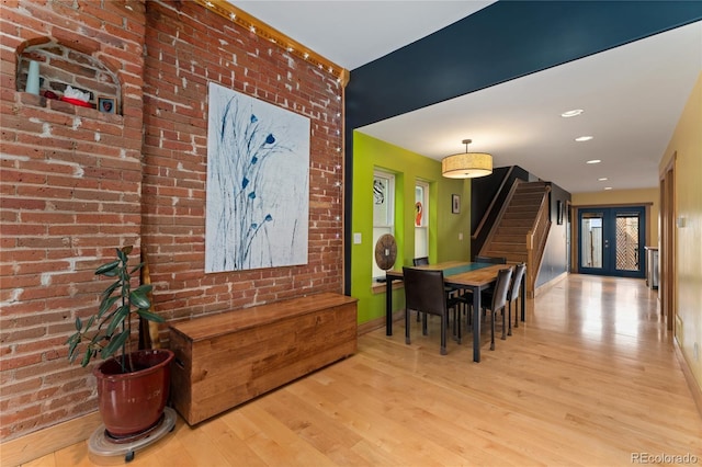 3313 Curtis St, Denver, CO 80205 - dining area featuring wood finished floors, stairs, baseboards, and recessed lighting