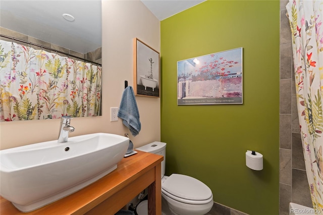 3313 Curtis St, Denver, CO 80205 - bathroom featuring toilet, a shower with shower curtain, and vanity