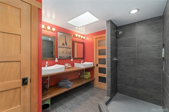 3313 Curtis St, Denver, CO 80205 - full bathroom with a skylight, tiled shower, tile patterned flooring, and double vanity