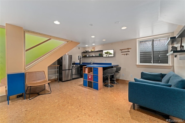 3313 Curtis St, Denver, CO 80205 - recreation room with recessed lighting, an office area, a sink, and baseboards