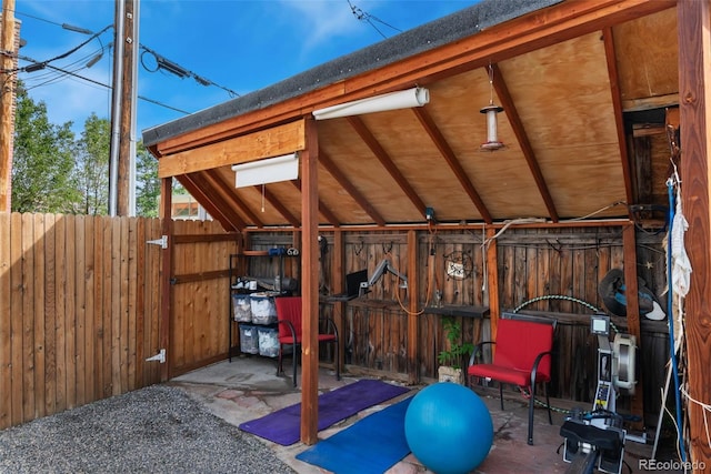3313 Curtis St, Denver, CO 80205 - workout room with wooden walls and vaulted ceiling