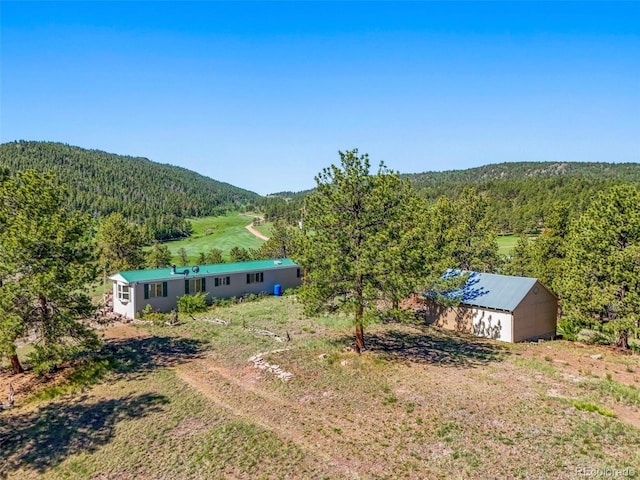 332 Valley Cir, Guffey, CO 80820 - aerial view of property and surrounding area featuring a heavily wooded area
