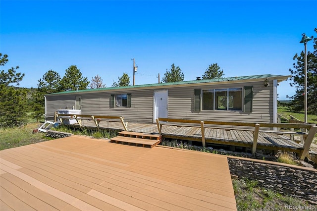 332 Valley Cir, Guffey, CO 80820 - view of front facade featuring a deck and a metal roof