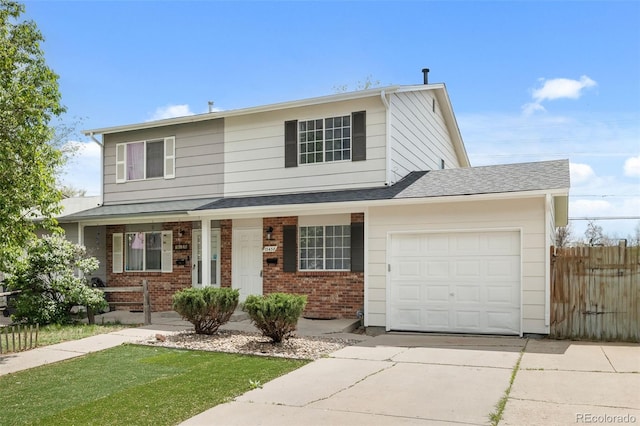 13438 E 13th Pl, Aurora, CO 80011 - traditional-style house with covered porch, driveway, a garage, brick siding, and fence