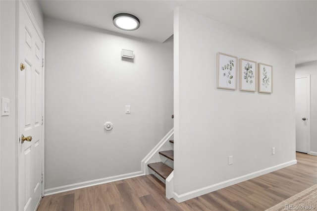 13438 E 13th Pl, Aurora, CO 80011 - stairway featuring baseboards and wood finished floors