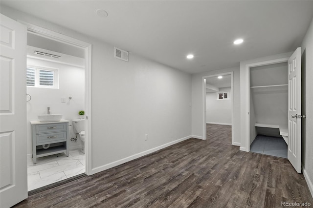 13438 E 13th Pl, Aurora, CO 80011 - unfurnished bedroom with visible vents, a closet, baseboards, recessed lighting, and ensuite bath