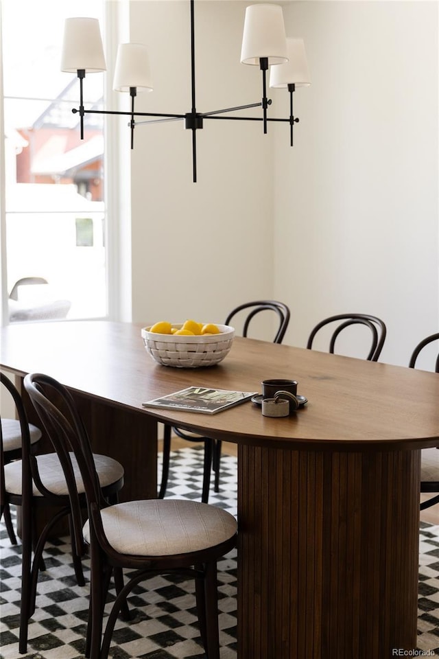 4131 Quivas St, Denver, CO 80211 - dining area with tile patterned floors and a chandelier