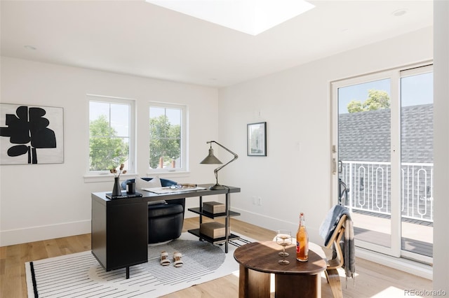 4131 Quivas St, Denver, CO 80211 - office featuring light wood-style flooring and a skylight