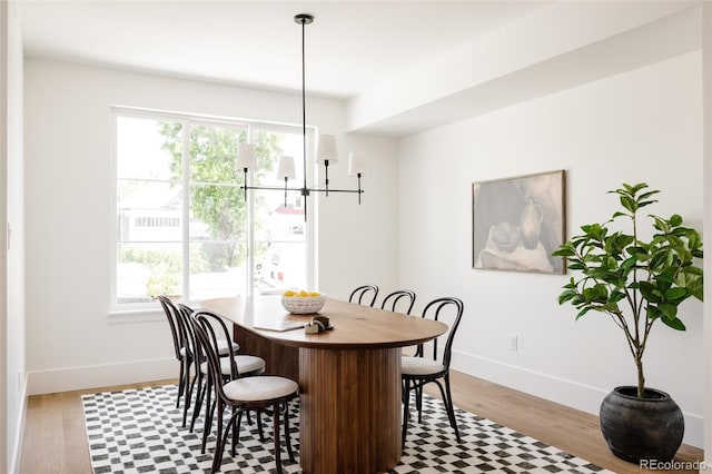 4131 Quivas St, Denver, CO 80211 - dining space with wood finished floors, healthy amount of natural light, and a chandelier