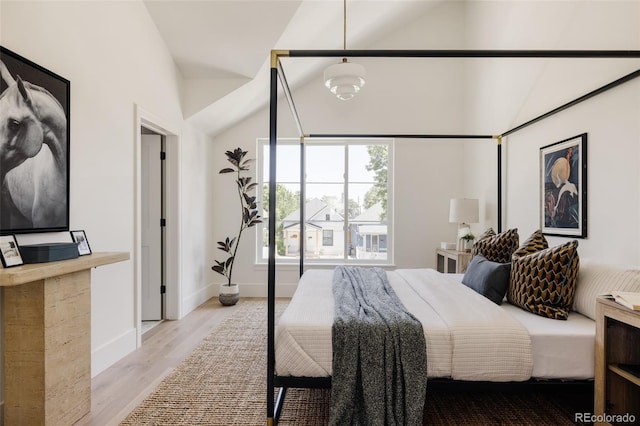 4131 Quivas St, Denver, CO 80211 - bedroom featuring vaulted ceiling and light wood-style floors