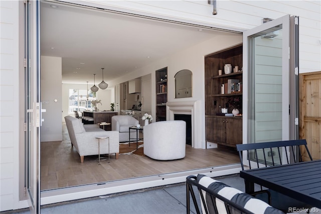 4131 Quivas St, Denver, CO 80211 - living area featuring wood finished floors and a fireplace