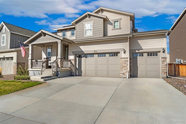 craftsman inspired home featuring a porch and a garage