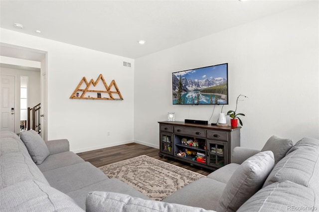 living room featuring dark wood-type flooring