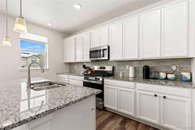 kitchen with white cabinets, stainless steel appliances, and sink