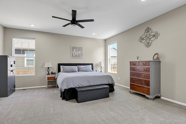 carpeted bedroom with ceiling fan, baseboards, multiple windows, and recessed lighting