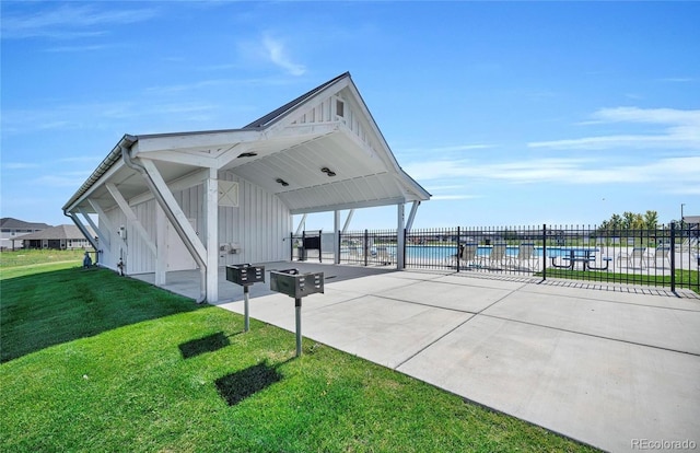 3248 Raintree Ln, Dacono, CO 80514 - view of patio with a carport and concrete driveway