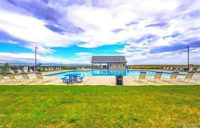 3248 Raintree Ln, Dacono, CO 80514 - community pool featuring a patio