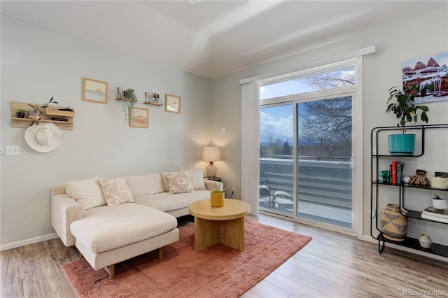living room with light wood-style floors and baseboards