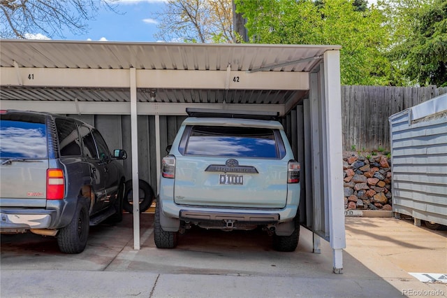 covered parking lot with fence