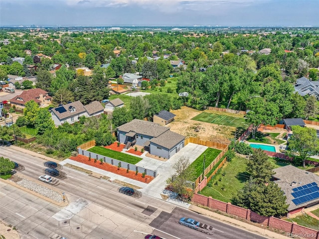 birds eye view of property with a residential view