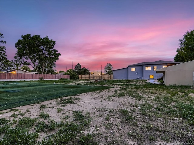 yard at dusk with fence