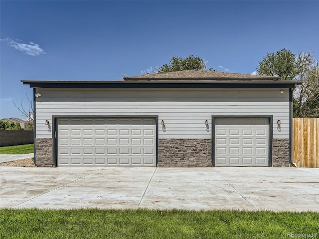 garage featuring fence