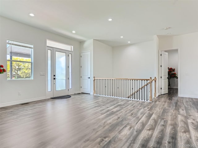 foyer entrance featuring visible vents, recessed lighting, wood finished floors, and baseboards