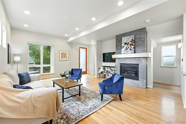 1376 Snowberry Ln, Louisville, CO 80027 - living room featuring light wood-style floors, a large fireplace, and recessed lighting