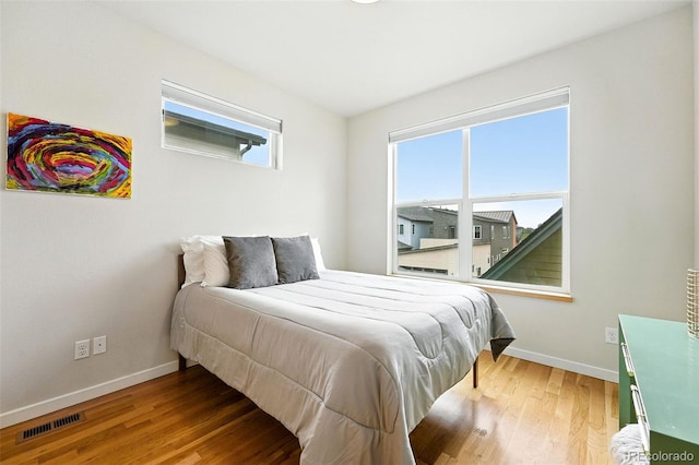 1376 Snowberry Ln, Louisville, CO 80027 - bedroom with baseboards and wood finished floors