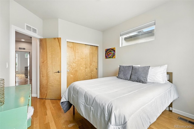 1376 Snowberry Ln, Louisville, CO 80027 - bedroom featuring wood finished floors and a closet