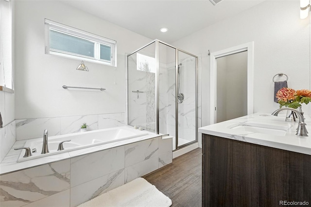 1376 Snowberry Ln, Louisville, CO 80027 - full bathroom with a marble finish shower, a bath, double vanity, and wood finished floors