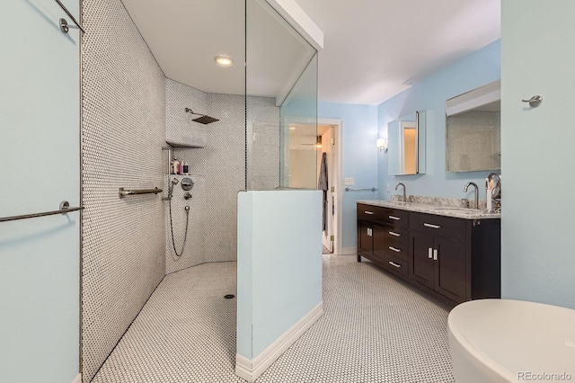 bathroom with walk in shower and double vanity