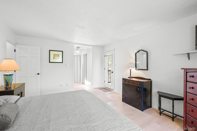 bedroom featuring light hardwood / wood-style floors and access to exterior