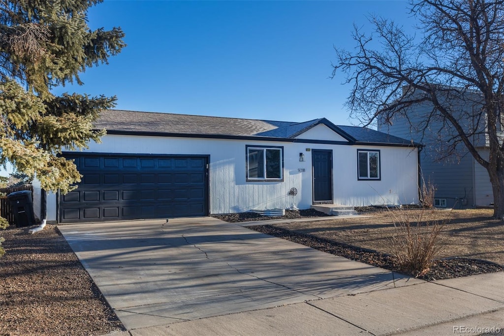 ranch-style home with a garage