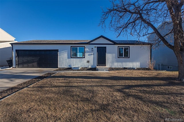 ranch-style home featuring a garage