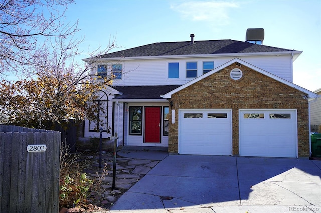 view of front of property with a garage