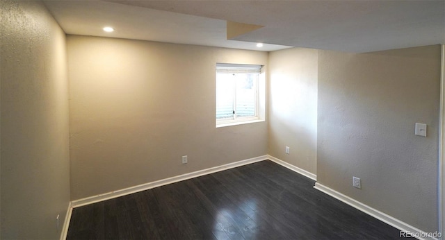 unfurnished room featuring dark hardwood / wood-style floors