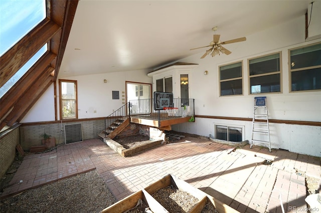 interior space with vaulted ceiling and ceiling fan