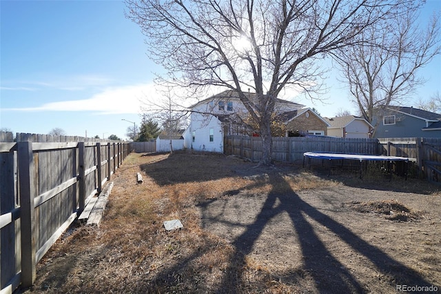 view of yard featuring a trampoline