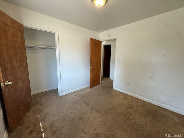 unfurnished bedroom with carpet and a closet