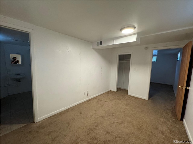 basement featuring carpet