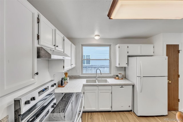 8479 Rabbitbrush Way, Parker, CO 80134 - kitchen featuring white appliances, under cabinet range hood, white cabinetry, light countertops, and light wood-type flooring